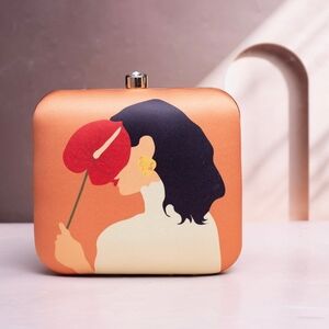 Handcrafted Stylish Orange Clutch with Artistic Design